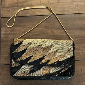 Elegant Beaded Clutch with Gold and Black Design